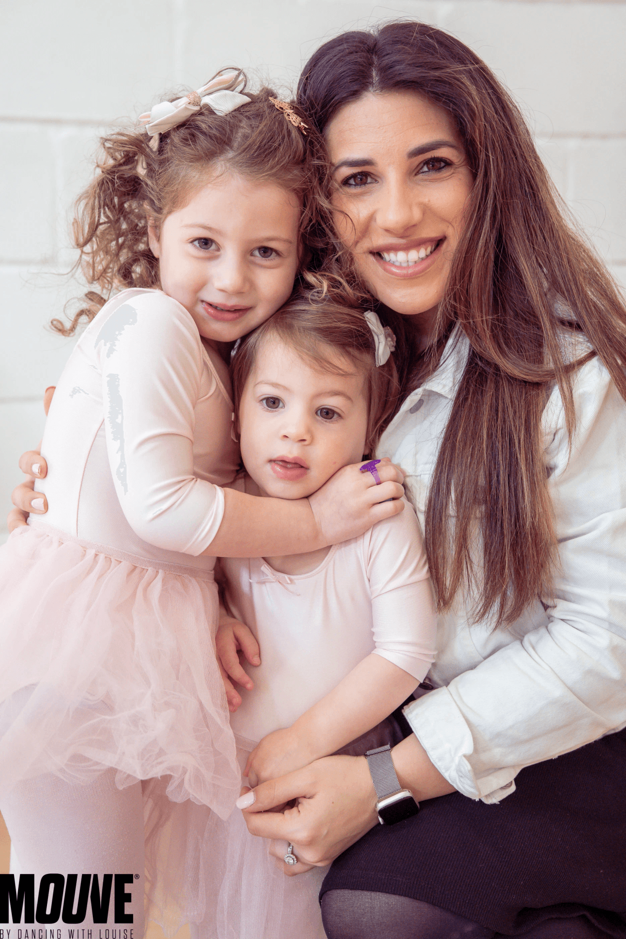 Louise with a parent and child at a MOUVE dance party